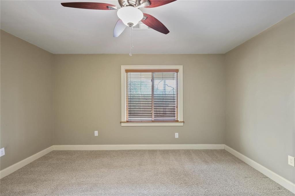 3851 Trickum Road Marietta, GA 30066 - Photo 17 of 27 an empty room with a window