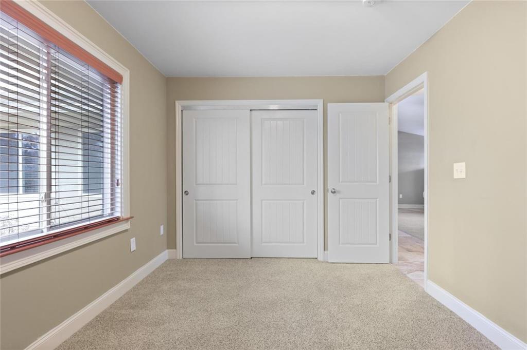 3851 Trickum Road Marietta, GA 30066 - Photo 20 of 27 a view of an empty room with a window