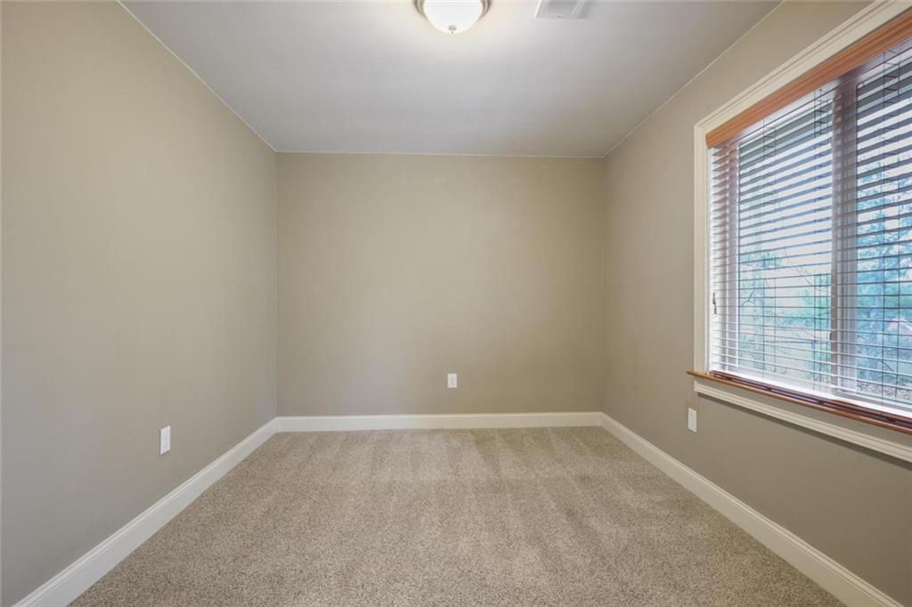 3851 Trickum Road Marietta, GA 30066 - Photo 21 of 27 a view of an empty room with a window