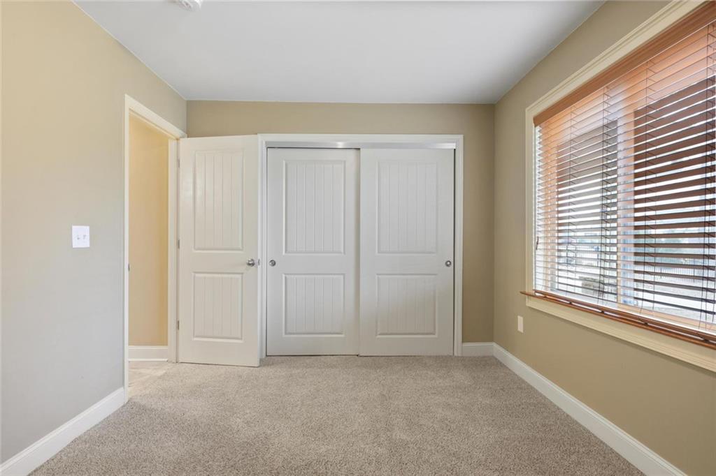 3851 Trickum Road Marietta, GA 30066 - Photo 24 of 27 a view of an empty room with a window