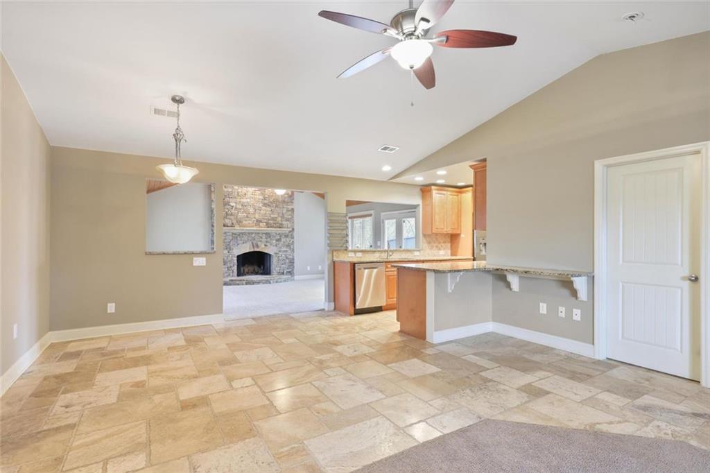 3851 Trickum Road Marietta, GA 30066 - Photo 6 of 27 a view of a kitchen with a sink and a fireplace