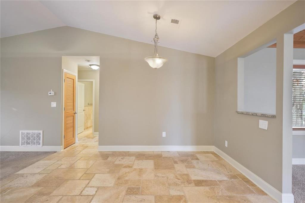 3851 Trickum Road Marietta, GA 30066 - Photo 8 of 27 a view of a kitchen with a sink and a window