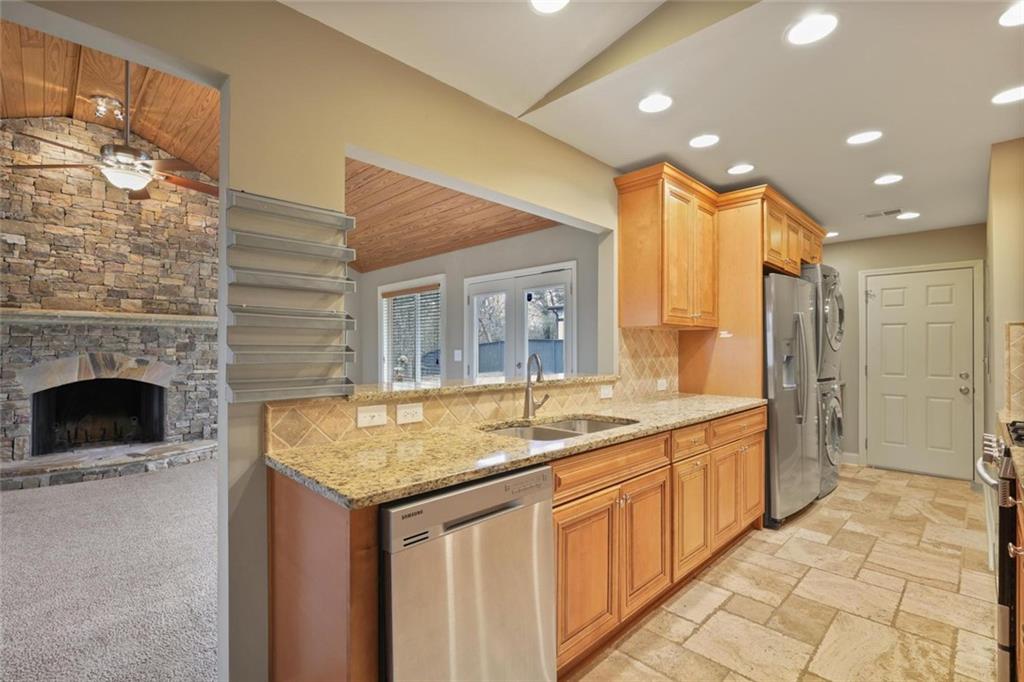 3851 Trickum Road Marietta, GA 30066 - Photo 10 of 27 a bathroom with a granite countertop sink and a mirror