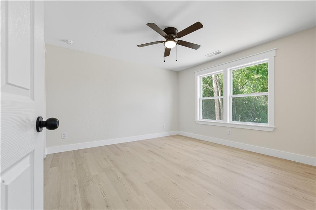5818 Eastside Drive Austell, GA 30168 - Photo 16 of 39 wooden floor in an empty room with a window