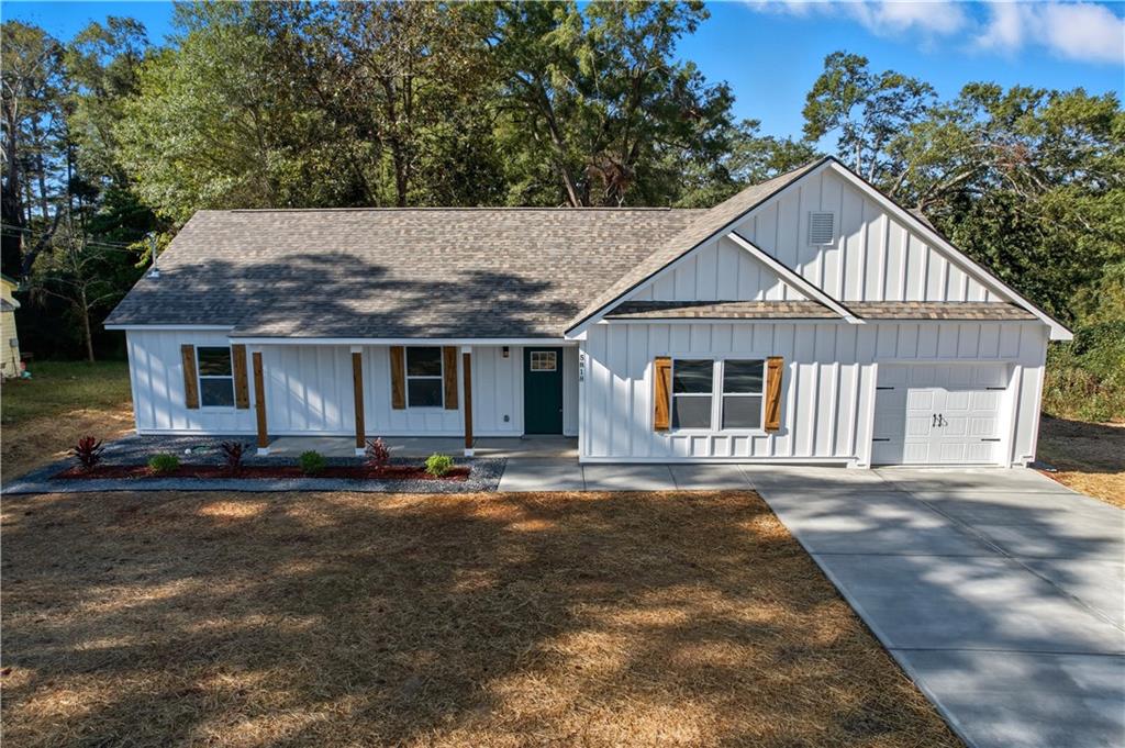 5818 Eastside Drive Austell, GA 30168 - Photo 2 of 39 a front view of a house with a garden