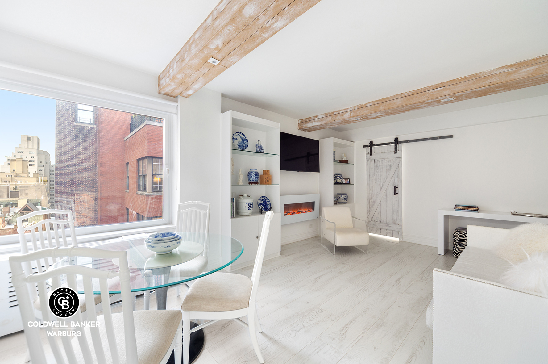 750 Park Avenue, Unit 16D Manhattan, NY 10021 - Photo 1 of 7 a living room with furniture and a flat screen tv