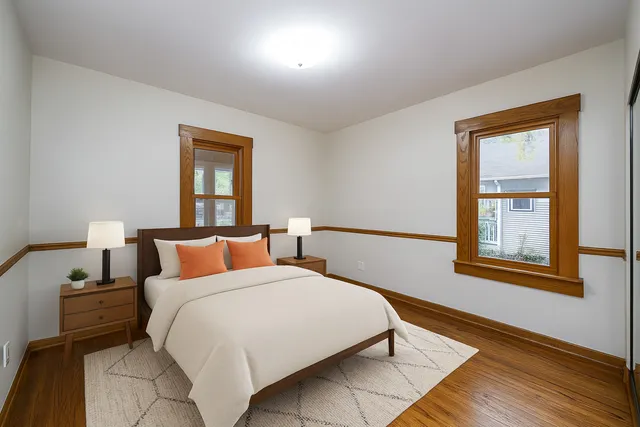 a bedroom with a bed and a dresser