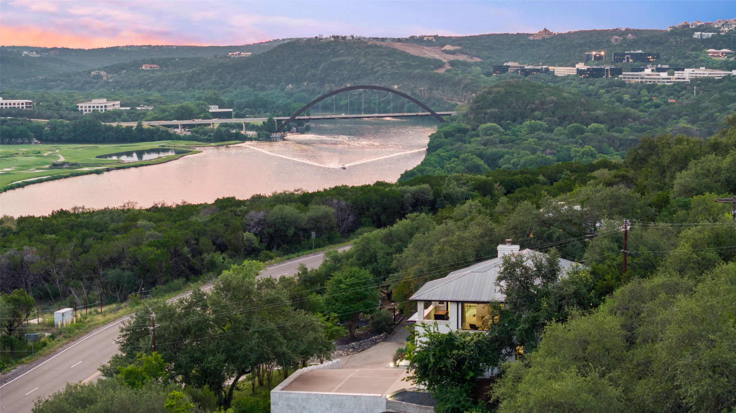 4808 Ranch Road 2222 Austin, TX 78731 - Photo 1 of 1 Aerial view of a water and mountain view and a notable bridge