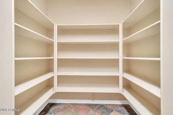 a view of an empty walk in closet
