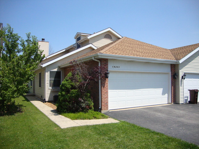 a front view of house with a yard
