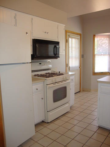 19201 Weber Road Mokena, IL 60448 - Photo 7 of 15 a kitchen with white cabinets stainless steel appliances and sink