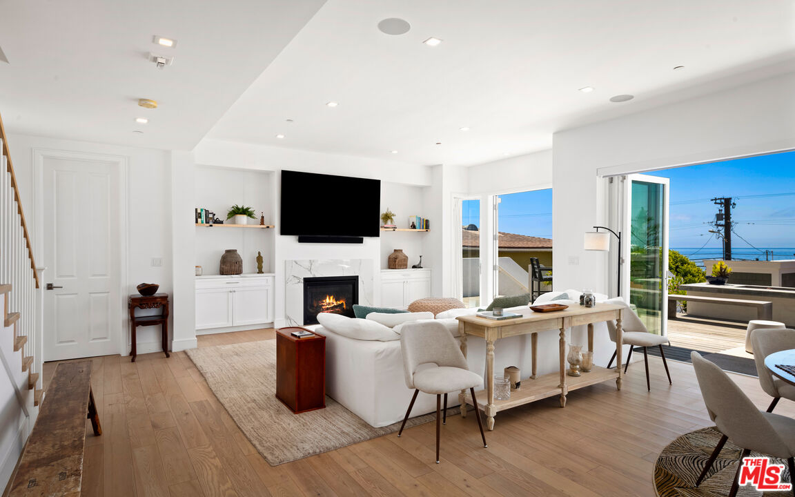 25157 Malibu Road Malibu, CA 90265 - Photo 5 of 33 a living room with furniture wooden floor and a flat screen tv