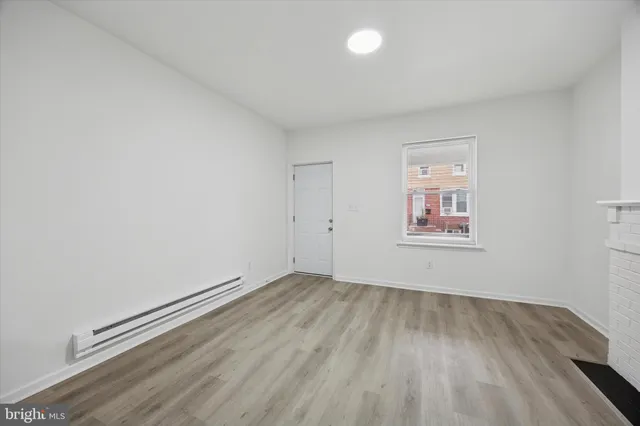 a kitchen with stainless steel appliances a refrigerator and a stove top oven