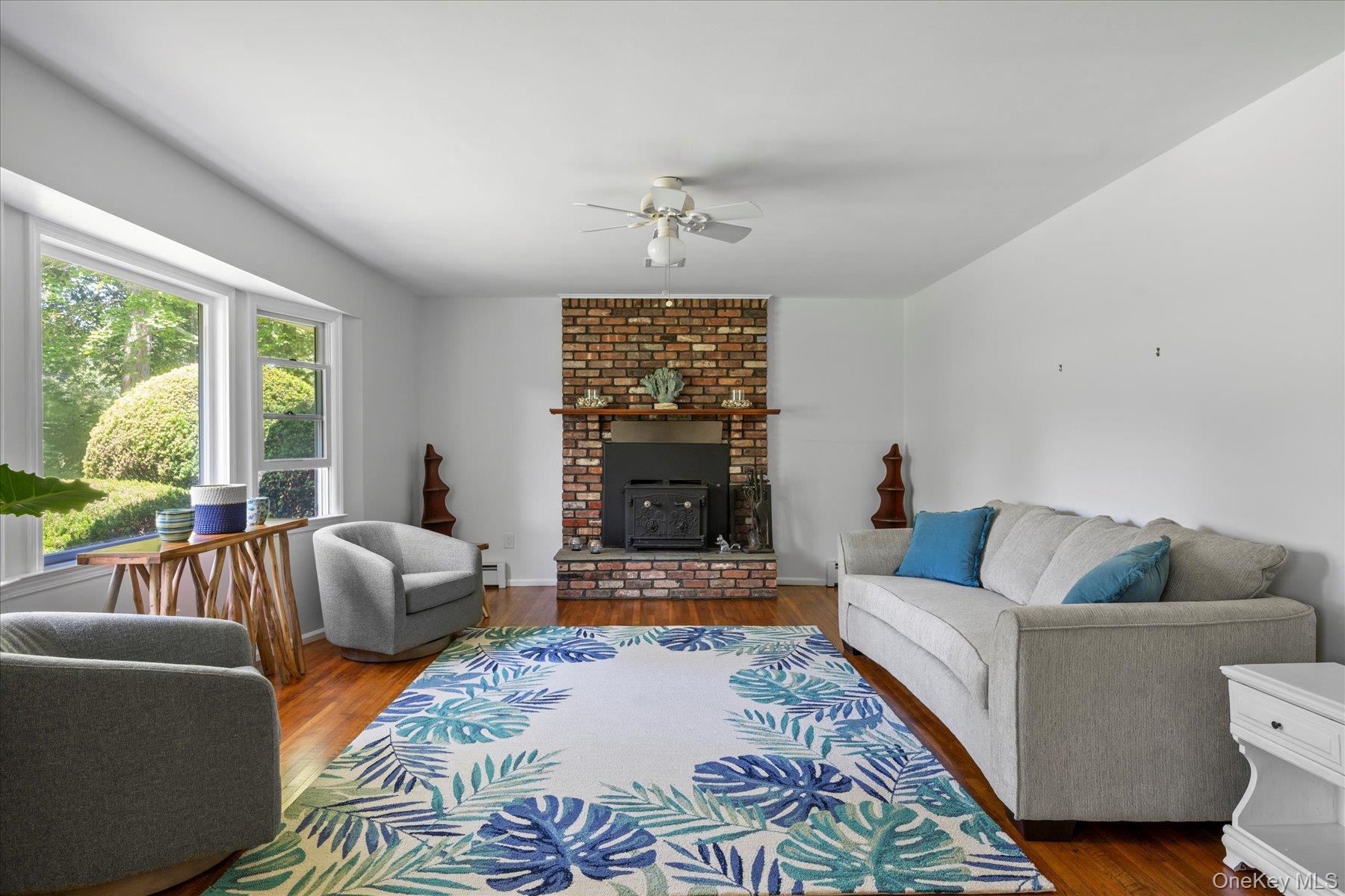64 Old Depot Road Quogue, NY 11959 - Photo 3 of 14 a living room with furniture and a large window