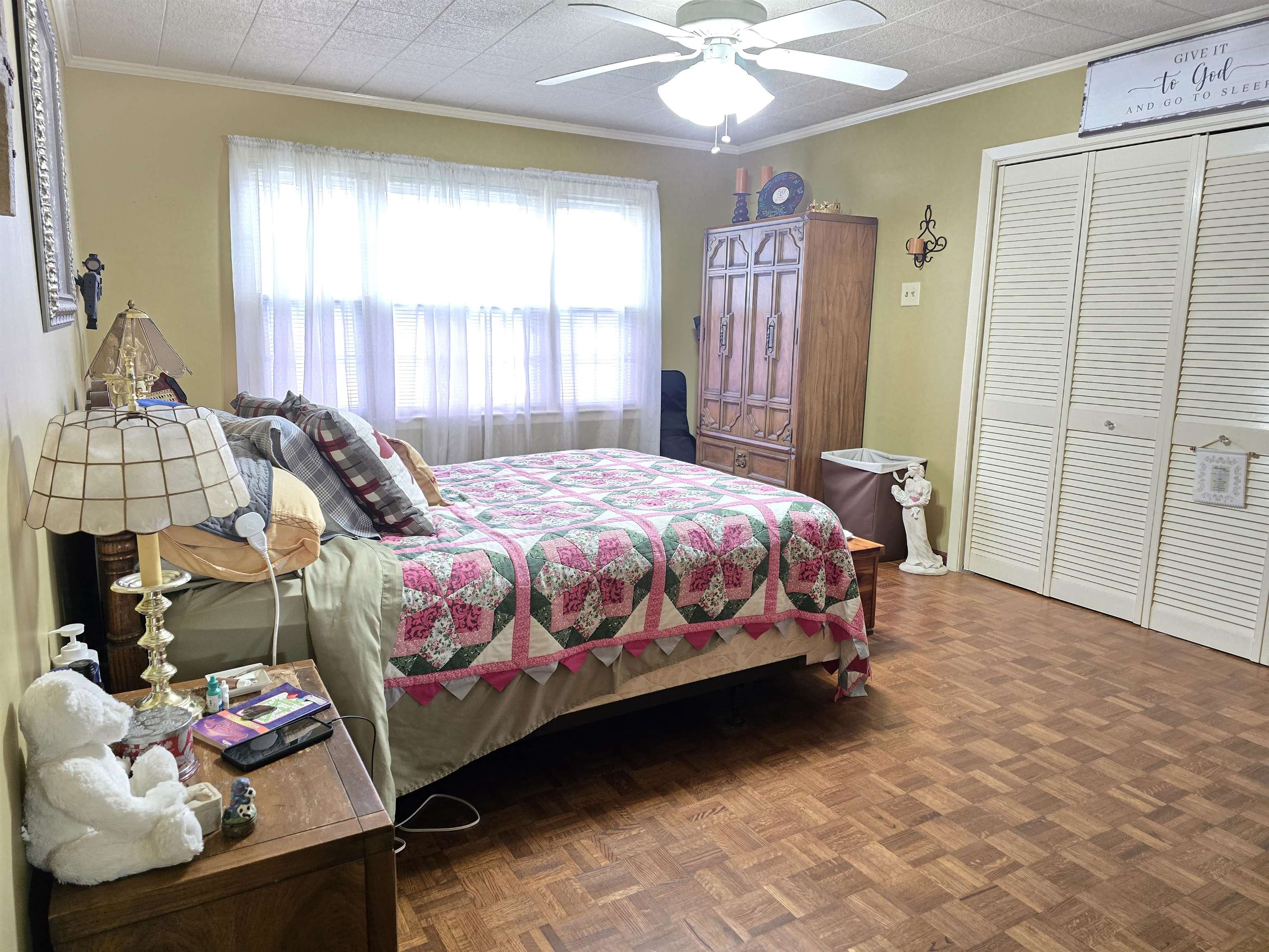 4885 Macon Road Memphis, TN 38122 - Photo 4 of 39 a bedroom with a bed mirror and window