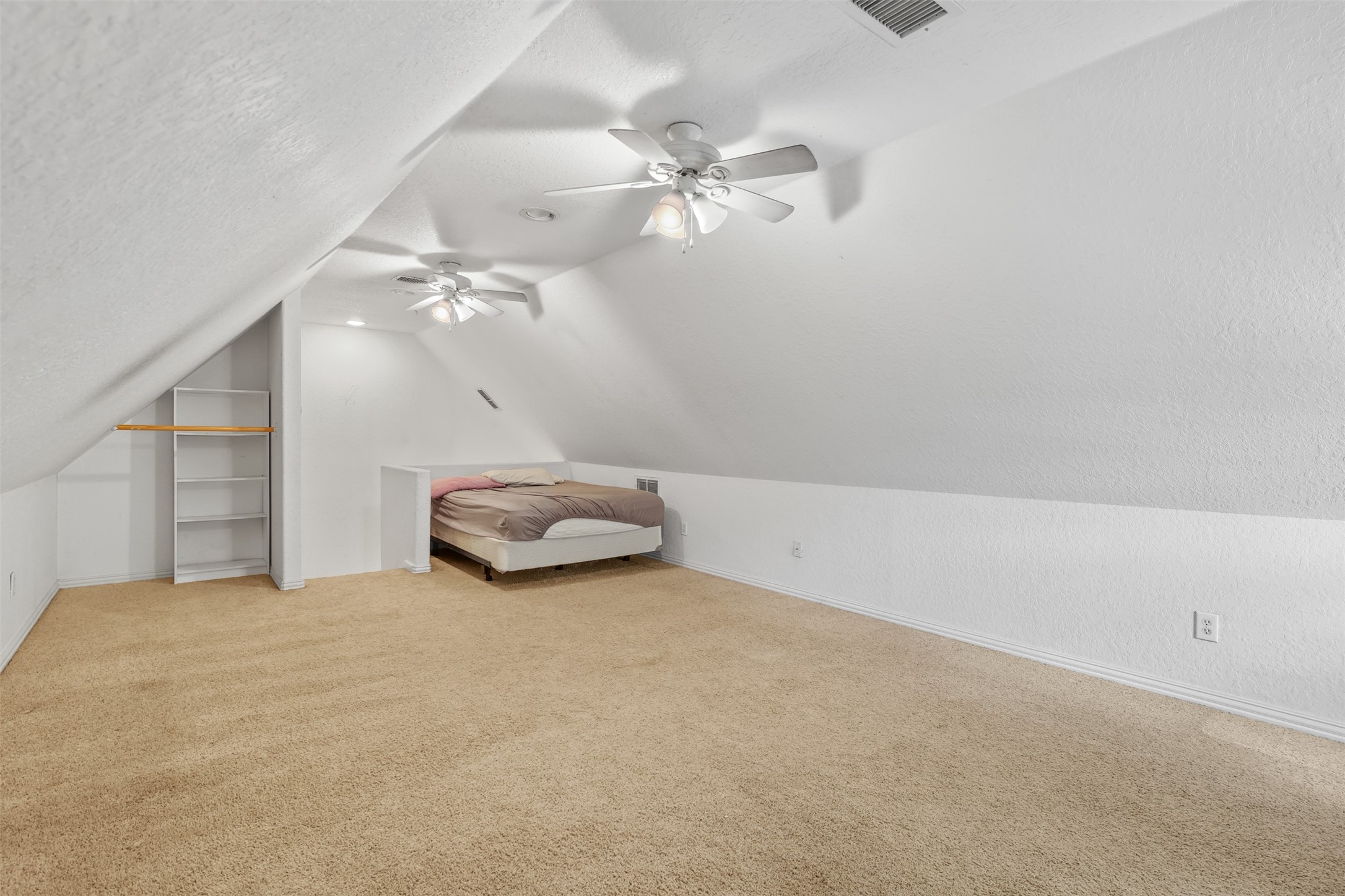 11692 Clark Lane Conroe, TX 77385 - Photo 18 of 35 This bonus room upstairs is perfect for a kids hang out or another bedroom by adding a door to the closet space. This room is zoned with the HVAC system, but also features a portable ac unit that cools the room quicker.