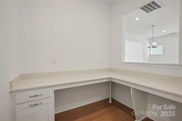 a view of storage and utility room with window