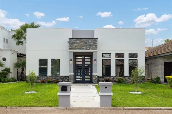 a front view of building with yard