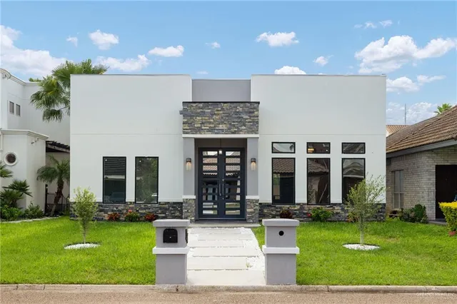 a front view of building with yard