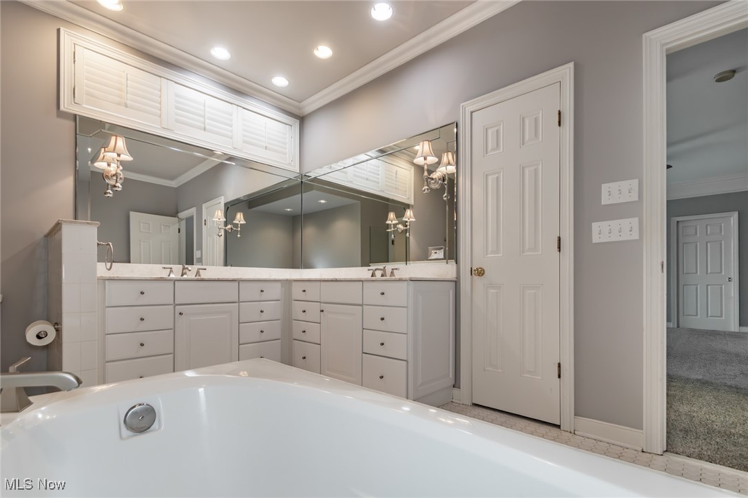 293 Burwick Road Cleveland, OH 44143 - Photo 20 of 50 Owner's bath featuring crown molding, double vanity, recessed lighting and linen closet!