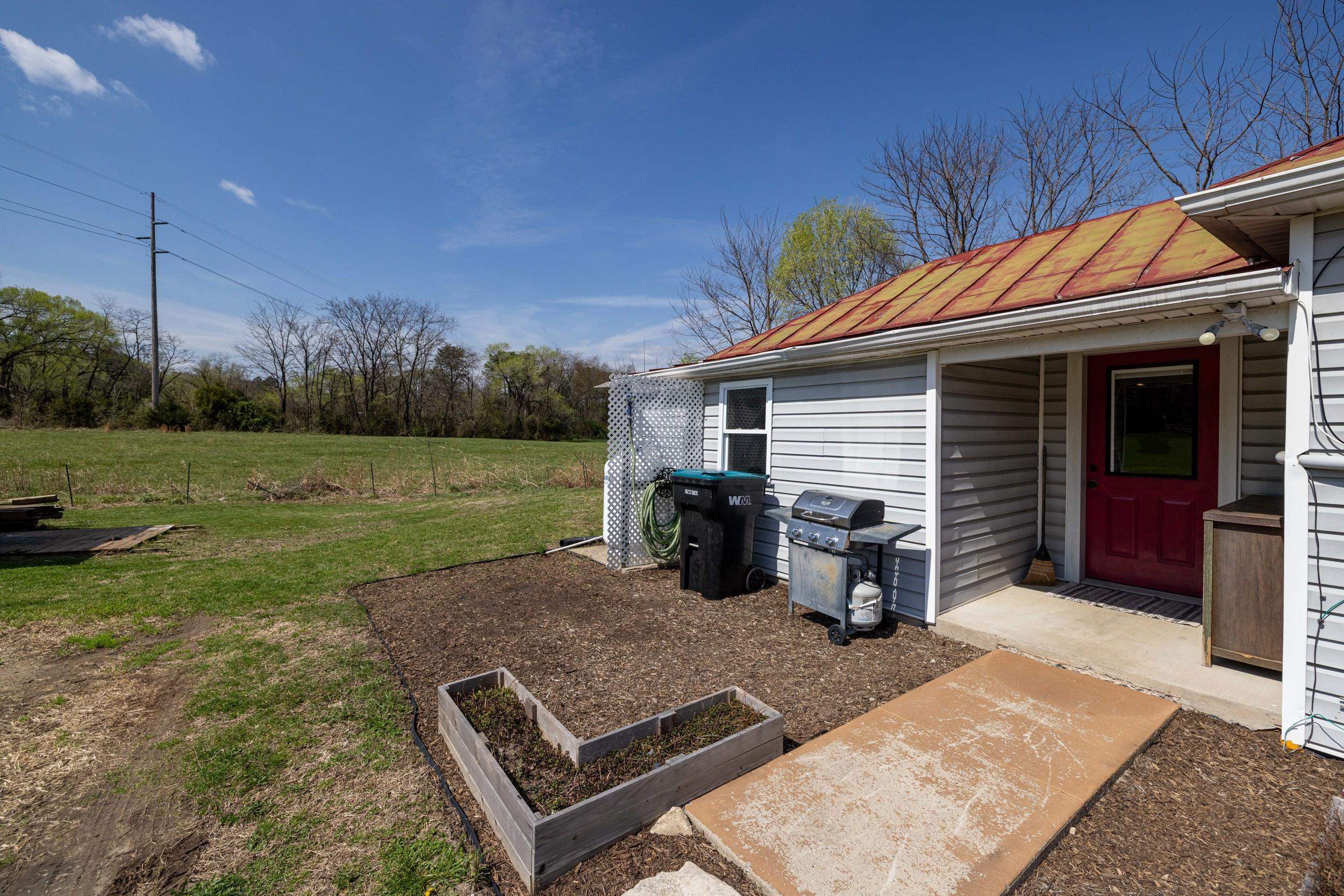 296 Keystone Road Stanley, VA 22851 - Photo 44 of 54 a view of a backyard with sitting area