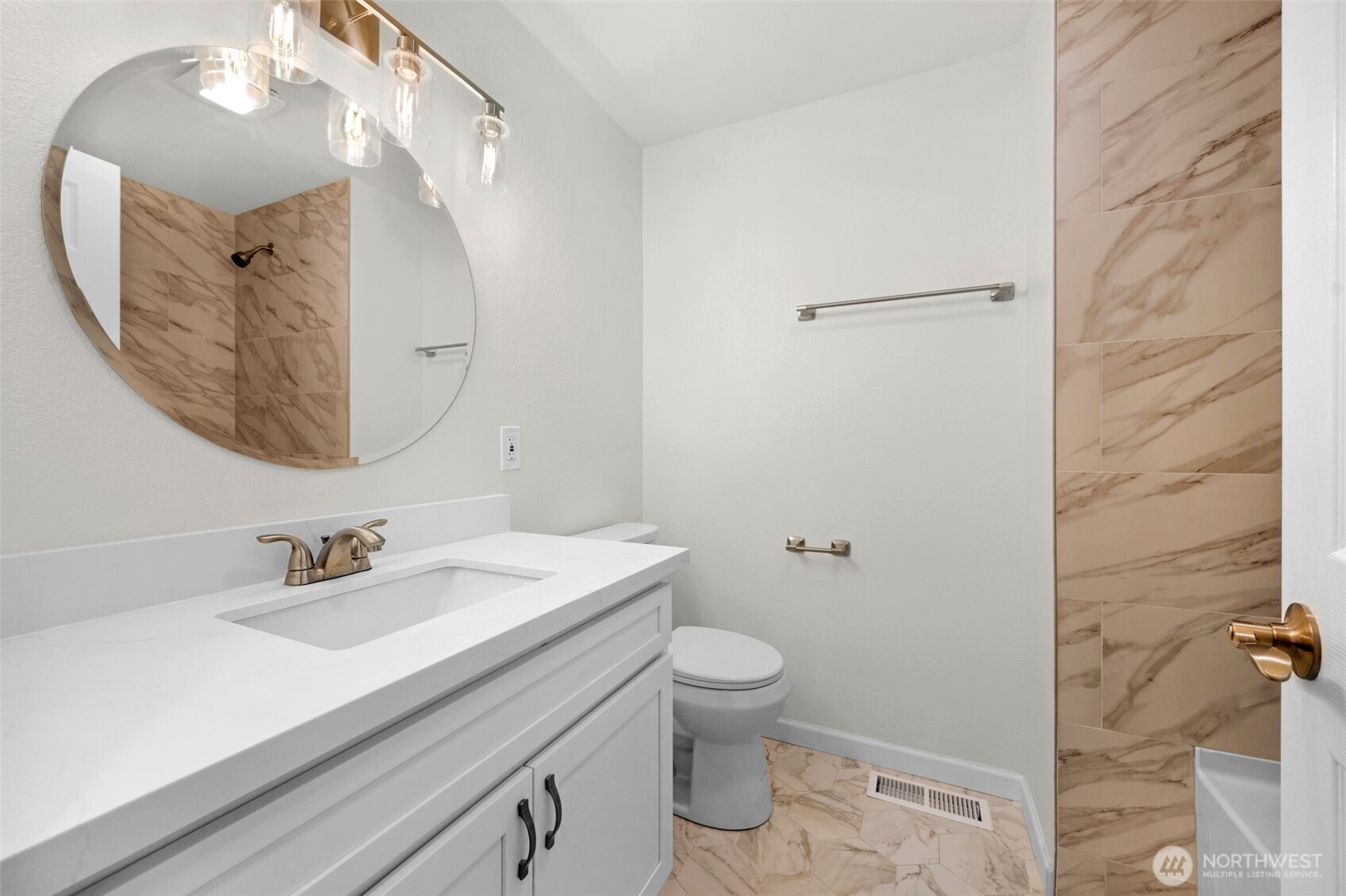 2400 177th Street Southeast Bothell, WA 98012 - Photo 15 of 29 a bathroom with a sink a toilet and a mirror