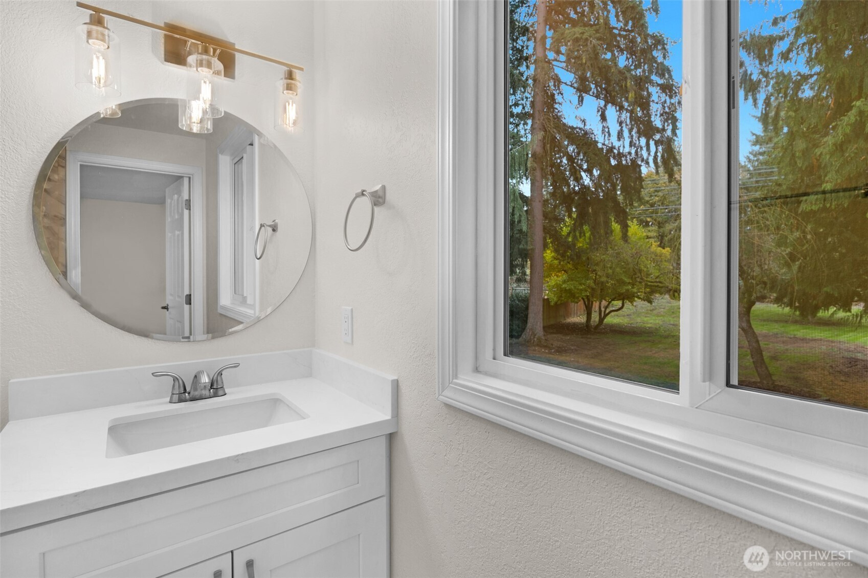 2400 177th Street Southeast Bothell, WA 98012 - Photo 18 of 29 a bathroom with a sink and a mirror