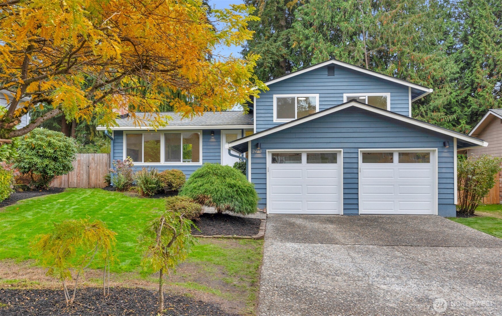2400 177th Street Southeast Bothell, WA 98012 - Photo 2 of 29 a front view of a house with a yard and garage