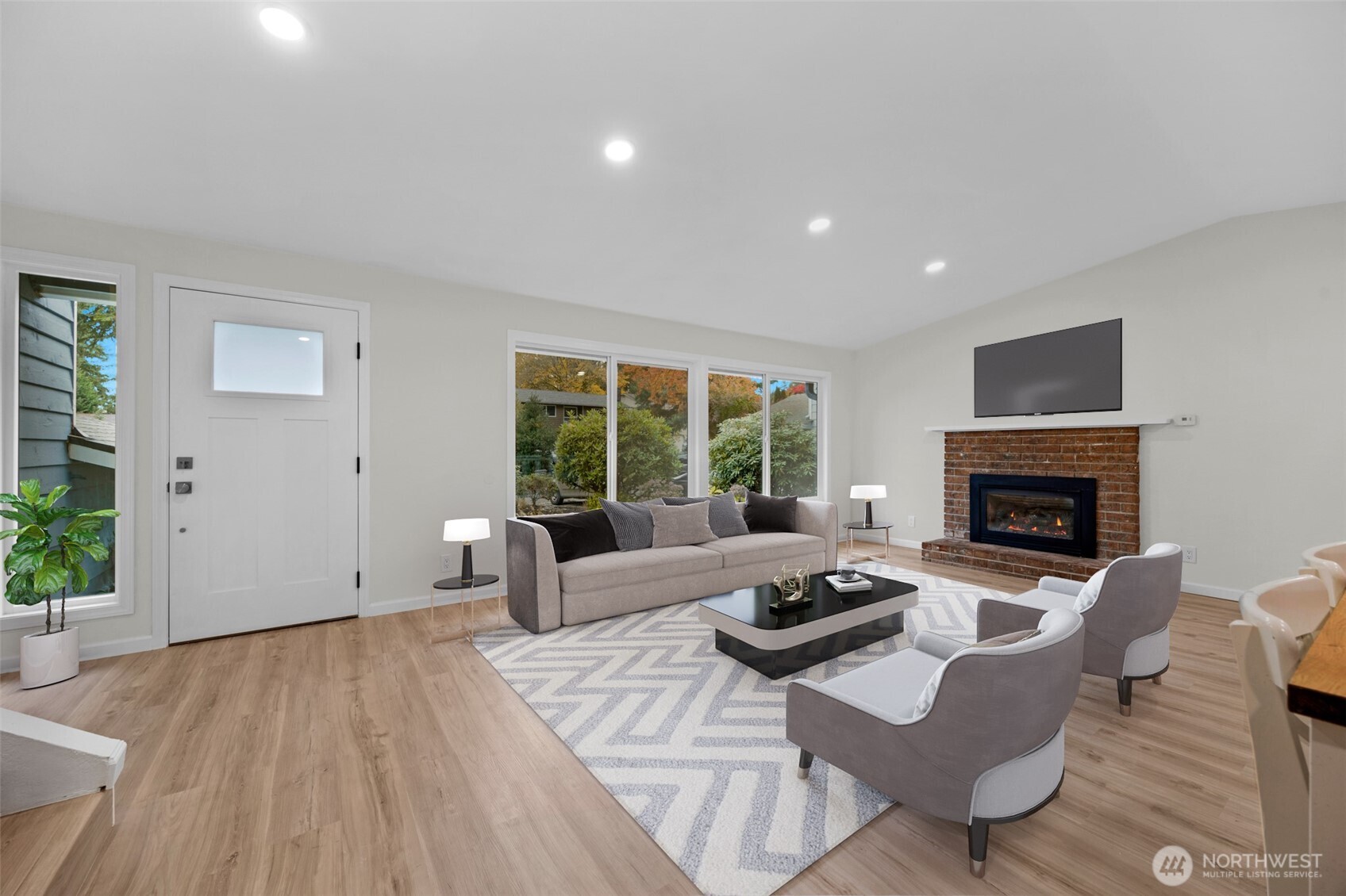 2400 177th Street Southeast Bothell, WA 98012 - Photo 4 of 29 a living room with furniture and a fireplace