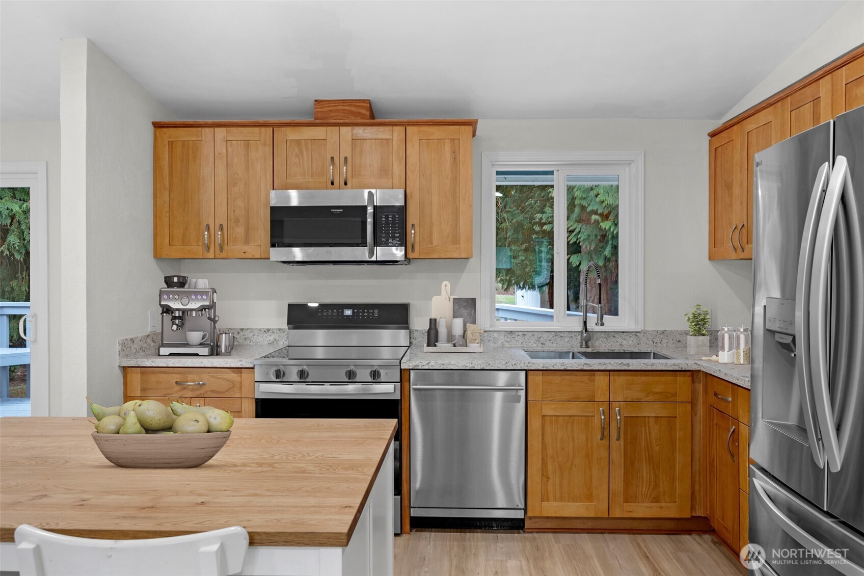 2400 177th Street Southeast Bothell, WA 98012 - Photo 9 of 29 a kitchen with stainless steel appliances granite countertop a stove a sink and a microwave