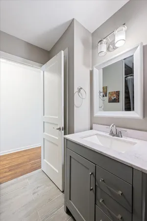 a bathroom with a sink and a mirror