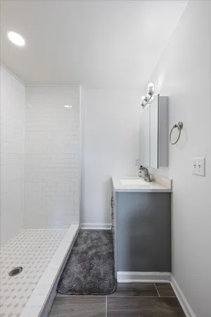 a bathroom with a sink and mirror