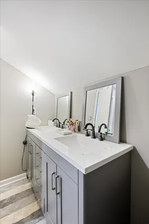 a bathroom with a sink and a mirror