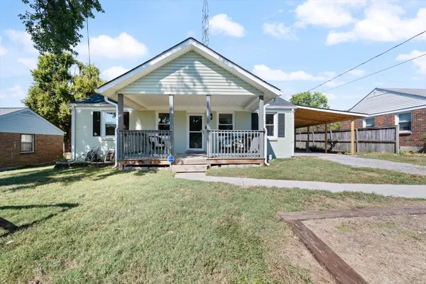 a view of a house with swimming pool and porch