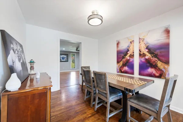a view of a dining room with furniture and wooden floor