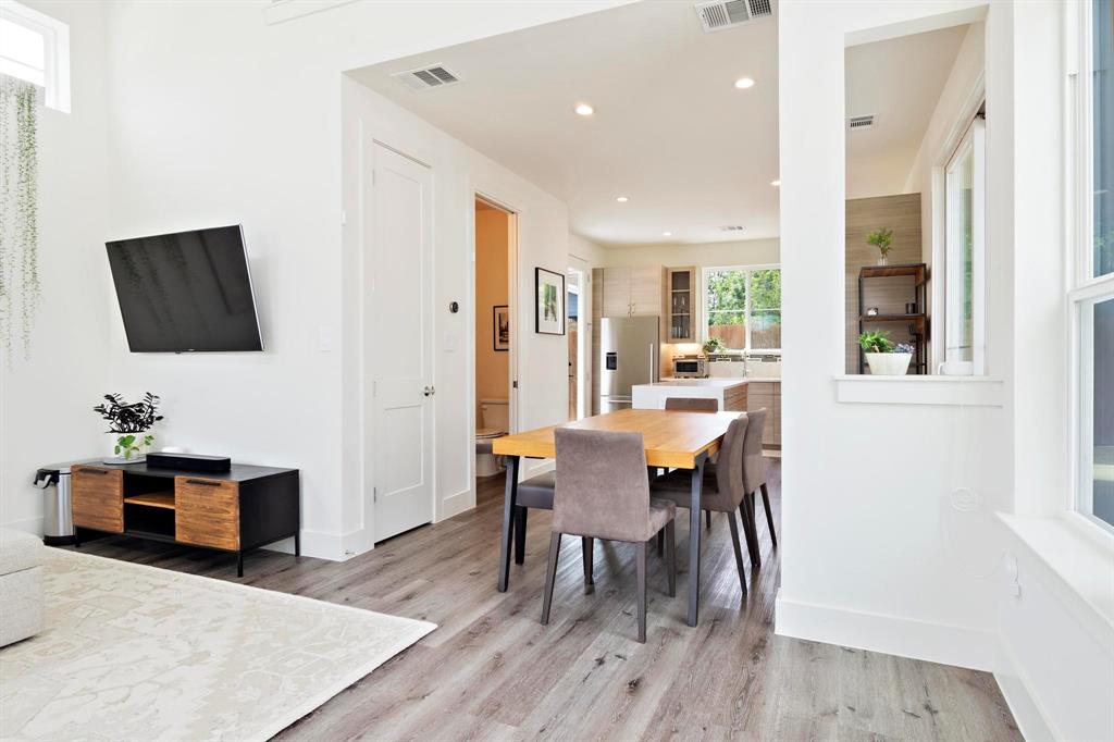 911 Stobaugh Street, Unit 2 Austin, TX 78757 - Photo 10 of 26 Open-concept living space featuring wood-finish flooring, recessed lighting, and white walls
