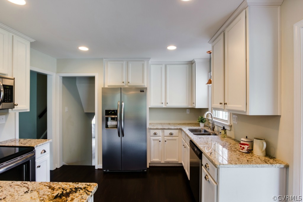 4055 Collingbourne Road Richmond, VA 23235 - Photo 5 of 24 a kitchen with a refrigerator sink and stove