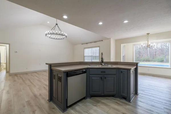 a kitchen with a sink and cabinets