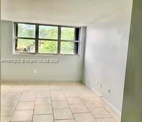 555 Northeast 30th Street, Unit 203 Miami, FL 33137 - Photo 9 of 23 an empty room with windows