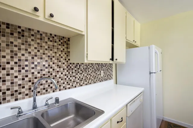 a bathroom with a sink a vanity and a shower