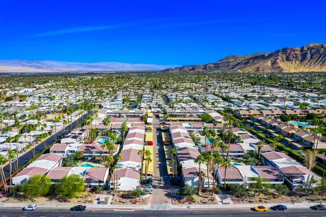 an aerial view of residential houses and outdoor space