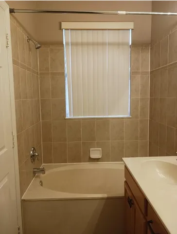 a bathroom with a shower and a bathtub