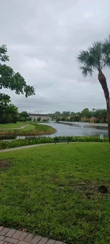 a view of a lake with a big yard