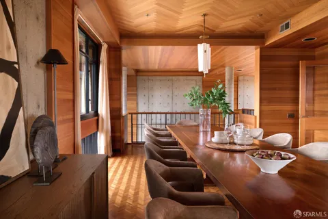 a view of a living room with furniture and window