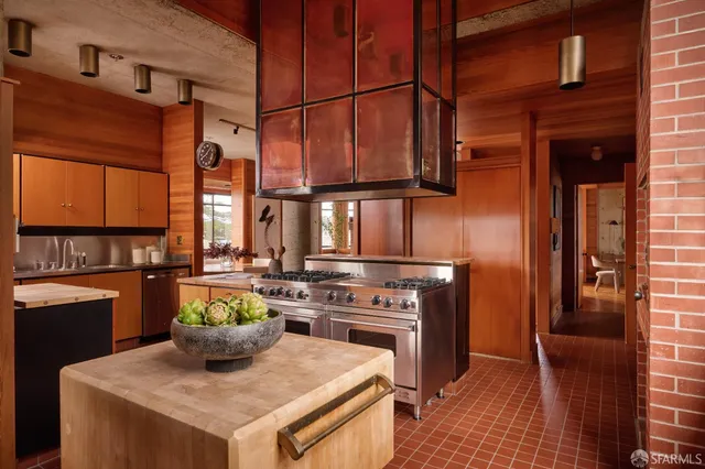 a kitchen with a stove and a refrigerator