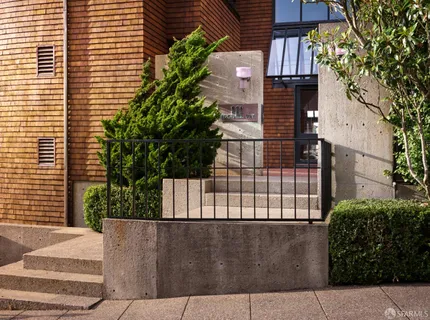 a view of living room with furniture and a rug
