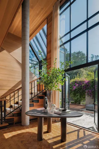 a building outdoor space with patio furniture and potted plants
