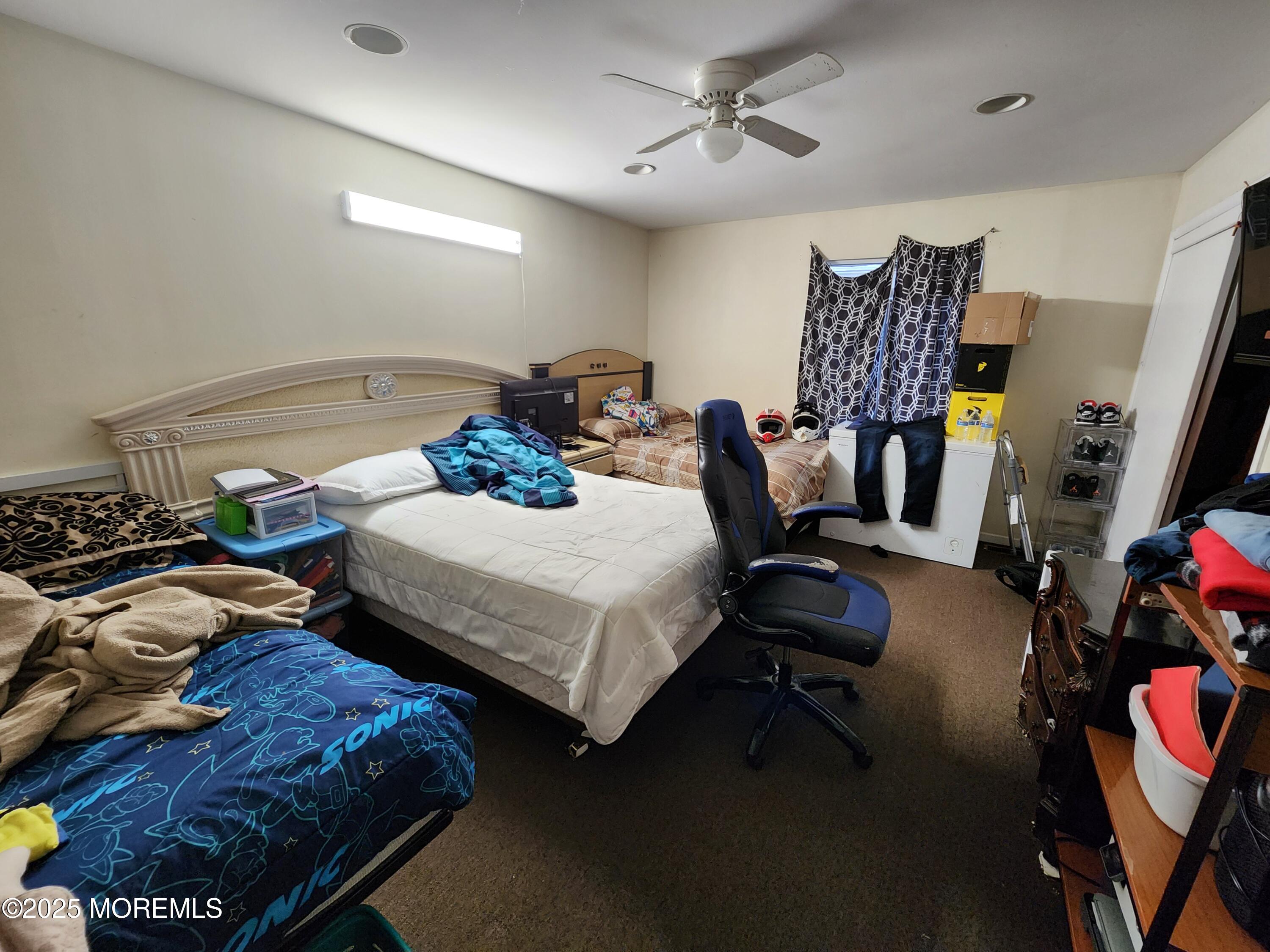 1102 Sawmill Road, Unit 99 Brick, NJ 08724 - Photo 12 of 13 a bedroom with bed tv and window
