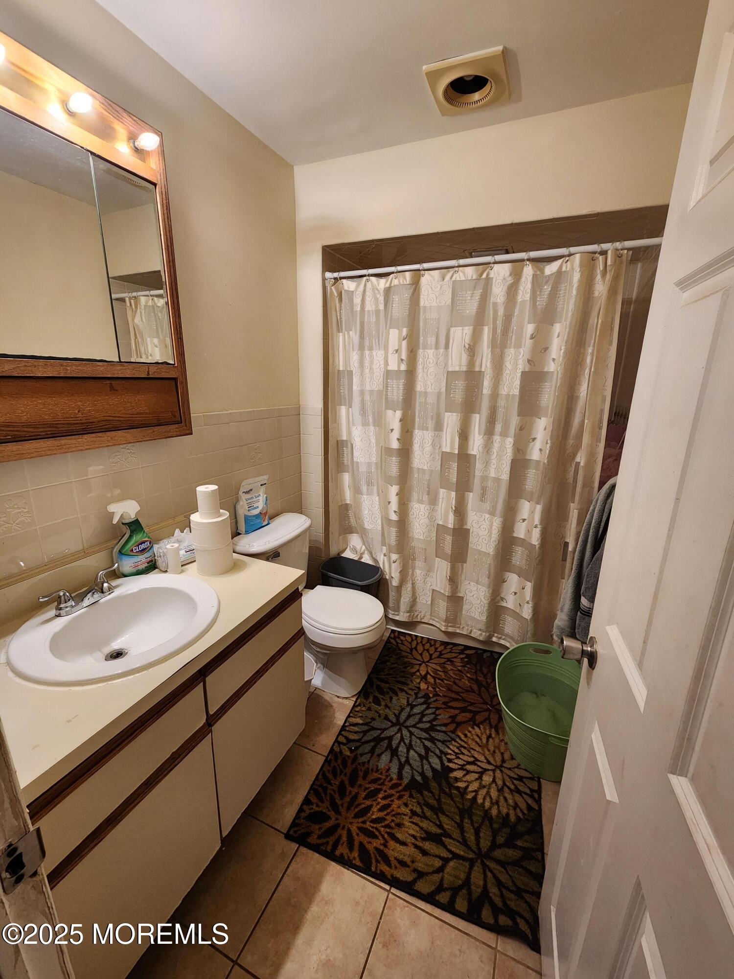 1102 Sawmill Road, Unit 99 Brick, NJ 08724 - Photo 13 of 13 a bathroom with a granite countertop sink and a mirror
