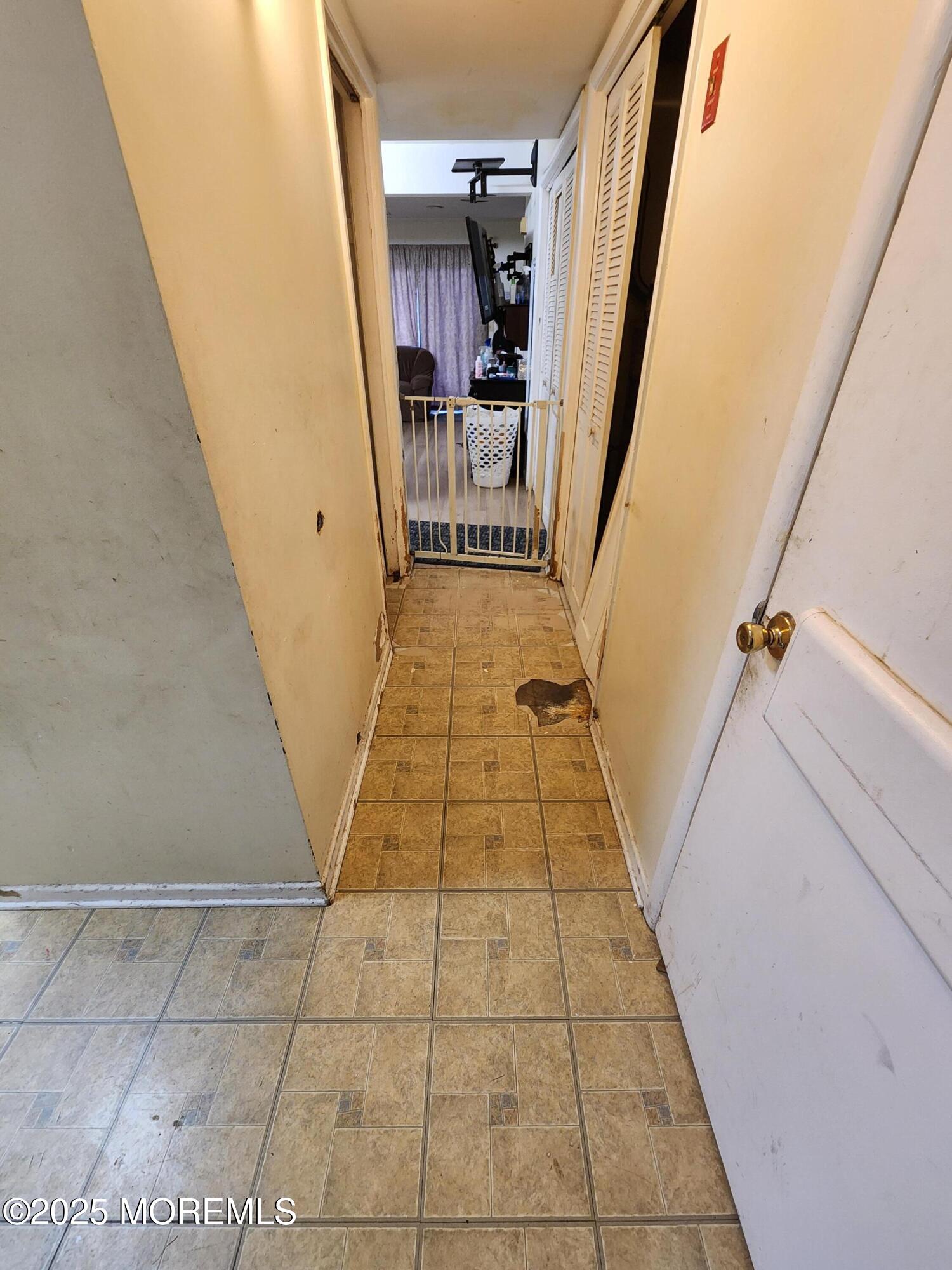 1102 Sawmill Road, Unit 99 Brick, NJ 08724 - Photo 3 of 13 a hallway view with staircase